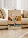 Framed abstract reader figure art leaning against beige sofa