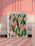Pink tulip Flower Market poster in a white frame beside a sofa