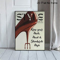 Red stiletto STYLE poster in thin black frame leaning against white paneled wall