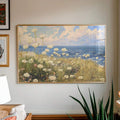 close-up artwork detail of Coastal meadow canvas wall art showing white wildflowers, ocean horizon, blue sky, soft clouds and airy impressionist cottage colors.
