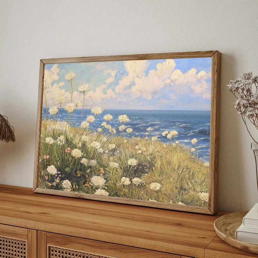frame option view of Coastal meadow canvas wall art showing white wildflowers, ocean horizon, blue sky, soft clouds and airy impressionist cottage colors.