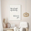 Black and white encouragement wall art in a neutral reading nook