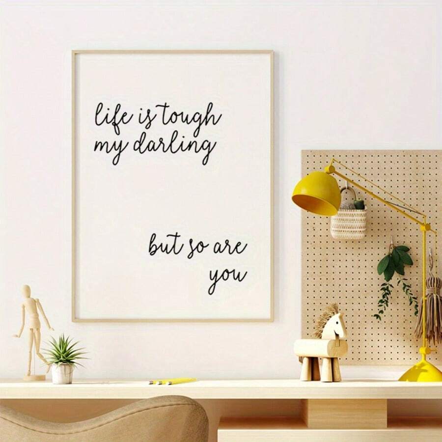 Life is tough my darling typography wall art above a creative desk