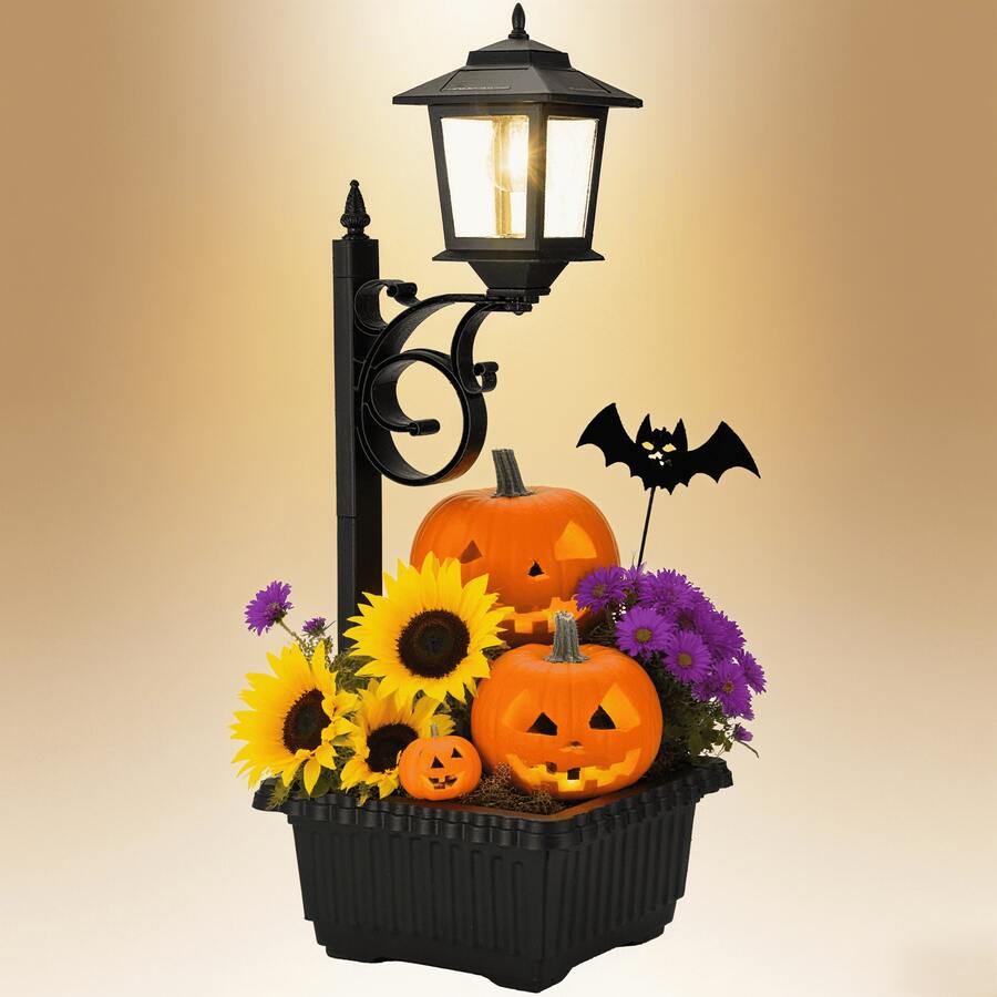 Black solar lamp post with planter lit beside front porch decor.