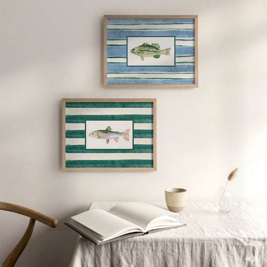 Two framed watercolor fish prints on wood shelf with blue and teal stripes