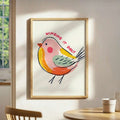 Pastel bird canvas poster framed in a dining area