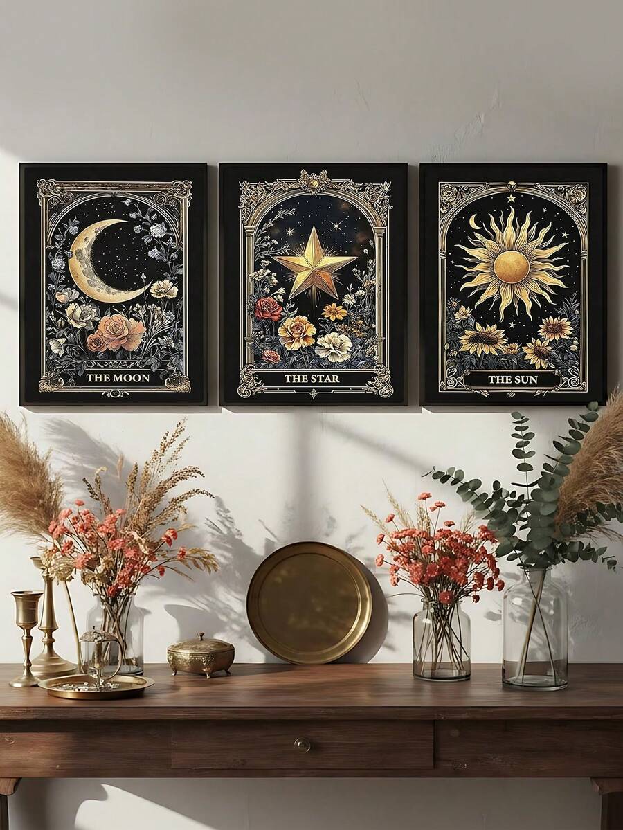 Dark celestial botanical triptych in black frames above a console