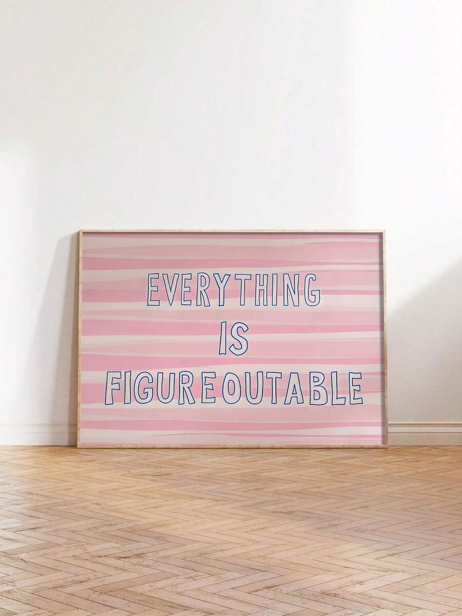 Large pink motivational quote print leaning on wood floor