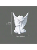 Hand image showing small palm-size white angel resin statue.