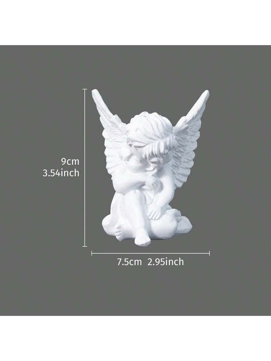 Hand image showing small palm-size white angel resin statue.
