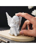 Size graphic showing white angel tabletop statue about 9 cm high and 7.5 cm wide.