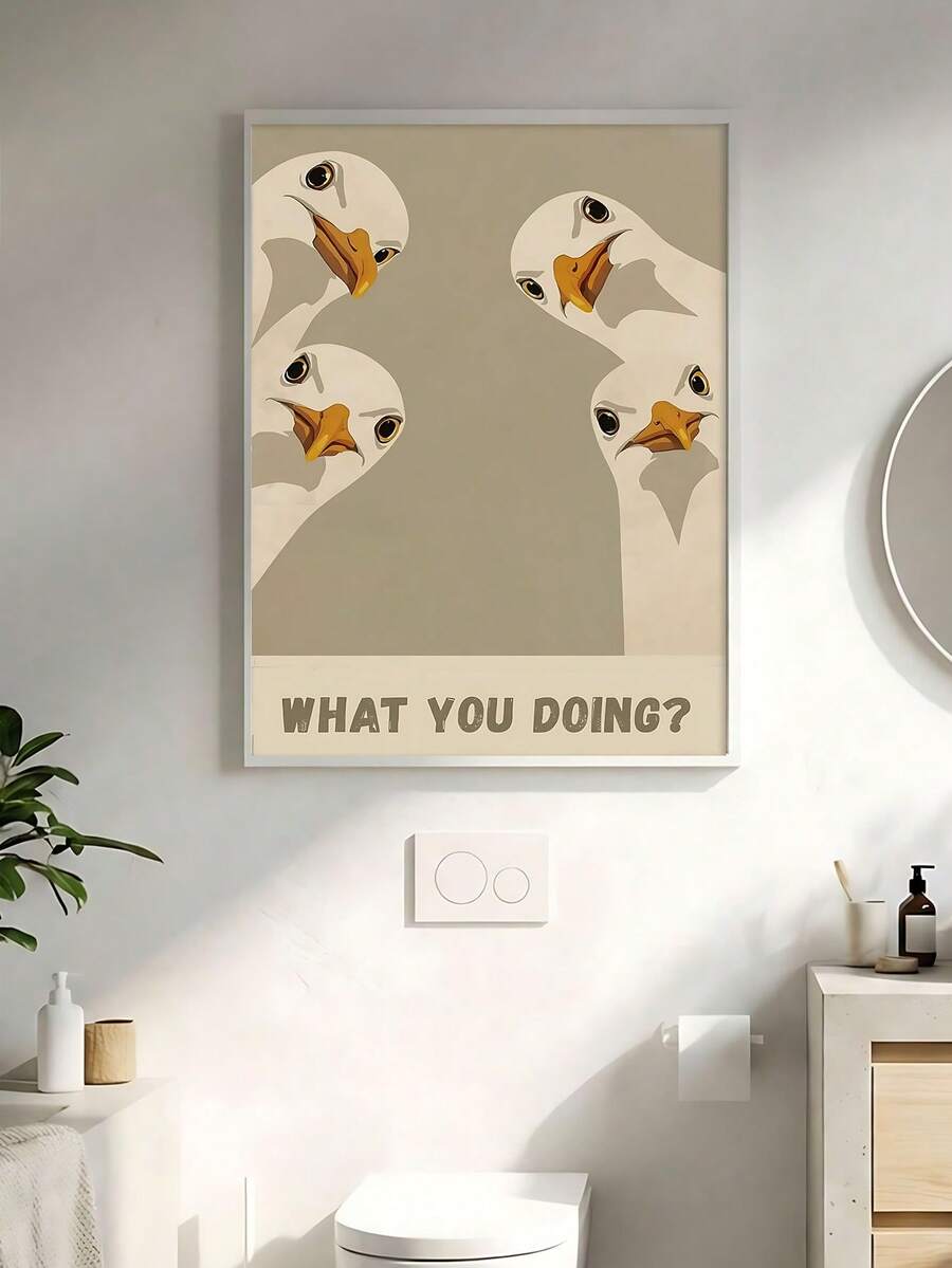Goose wall art above toilet with What you doing text and light wood frame
