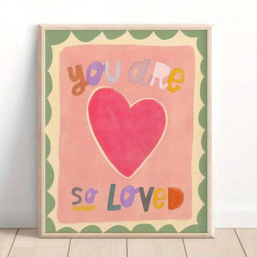 Pink watercolor nursery poster with large heart and text you are so loved