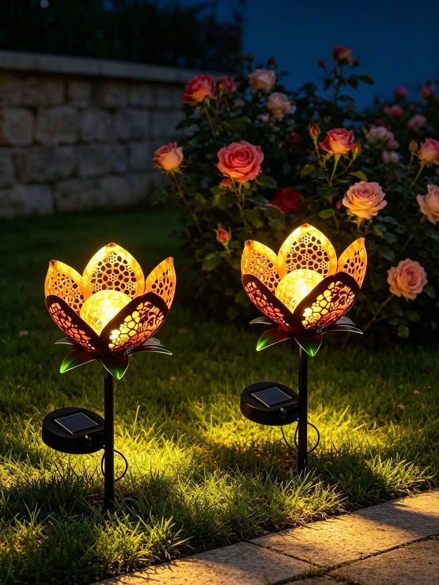 Garden stake light close-up pair with side solar panels patterned petals and green leaves