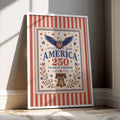 American eagle and Liberty Bell anniversary art displayed in a white frame