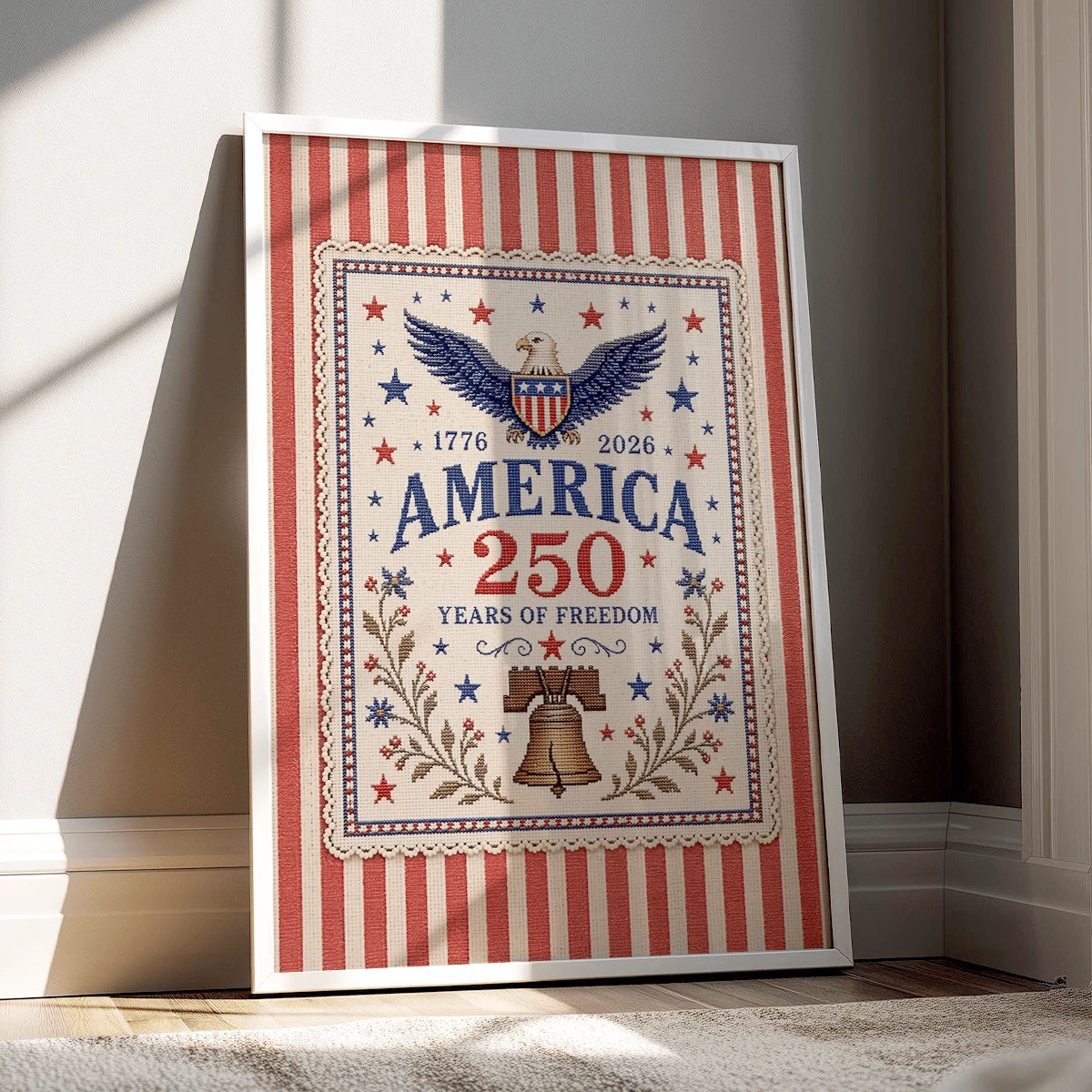 American eagle and Liberty Bell anniversary art displayed in a white frame