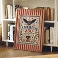 Vintage patriotic canvas print in a light wood frame beside books