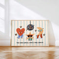 Framed disco kids wall art leaning on sunlit wood floor