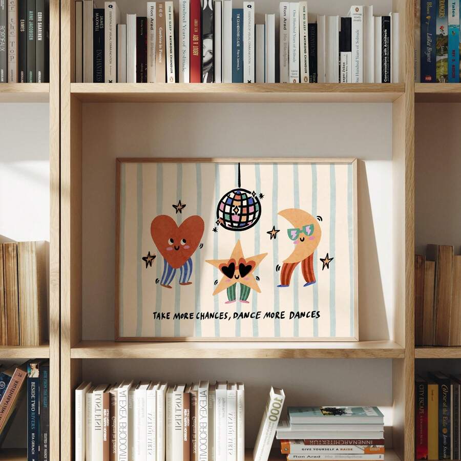 Framed kids motivational dance print displayed inside wooden bookshelf