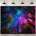 Cosmic forest wall hanging displayed above sofa with vivid blue purple and pink stars