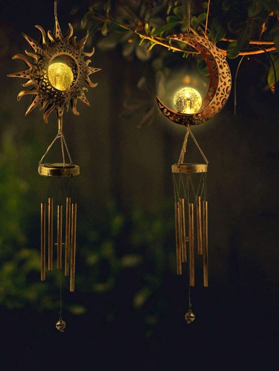 Bronze crescent moon wind chime with cracked glass globe and chime tubes.