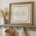 Neutral animal wall art leaning on wooden shelf