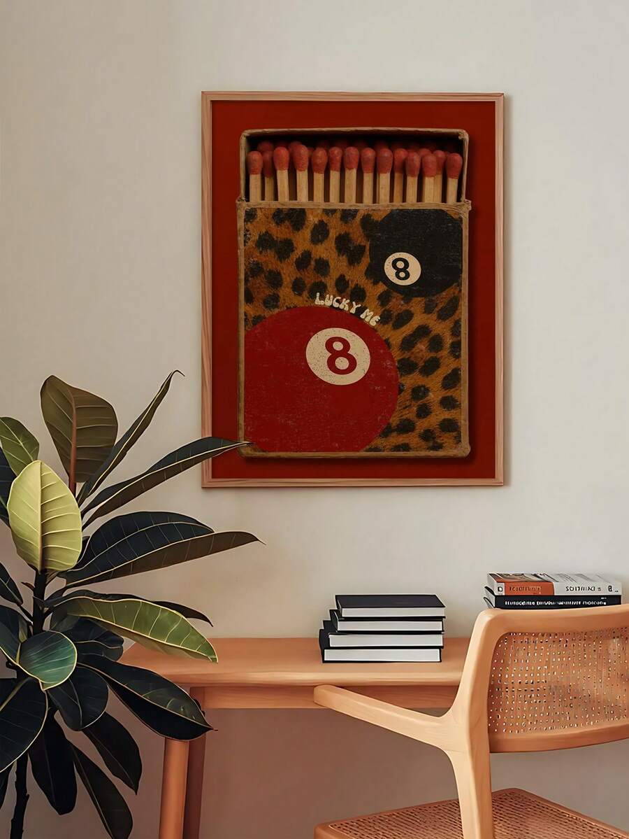 Maximalist decor workspace with Lucky Me 8-ball matchbox print above desk