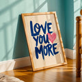 Blue quote and pink heart wall art styled against teal bedroom wall