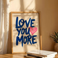 Love You More framed print with books plant and sheer curtain