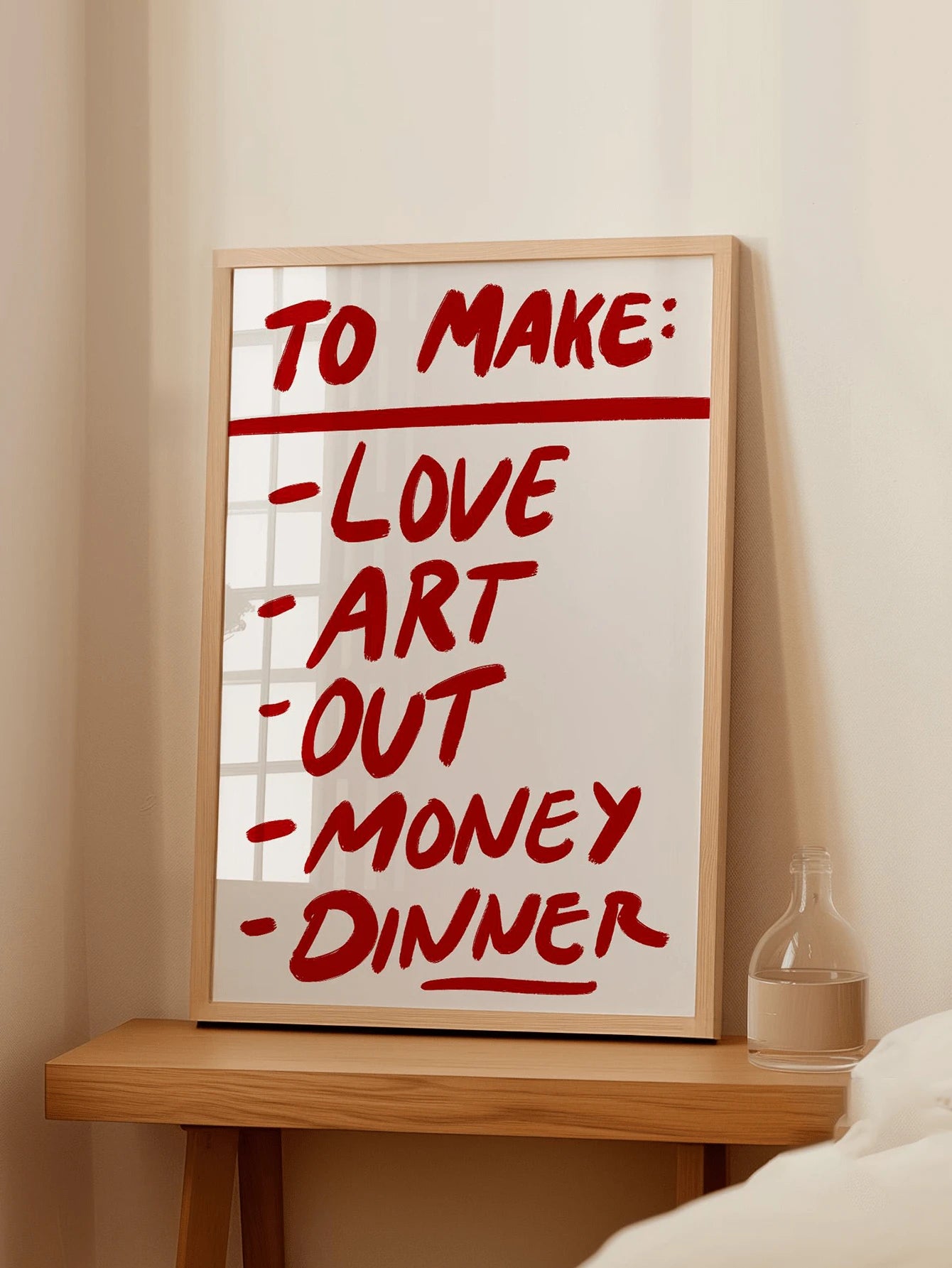 Framed typography canvas print shown above console