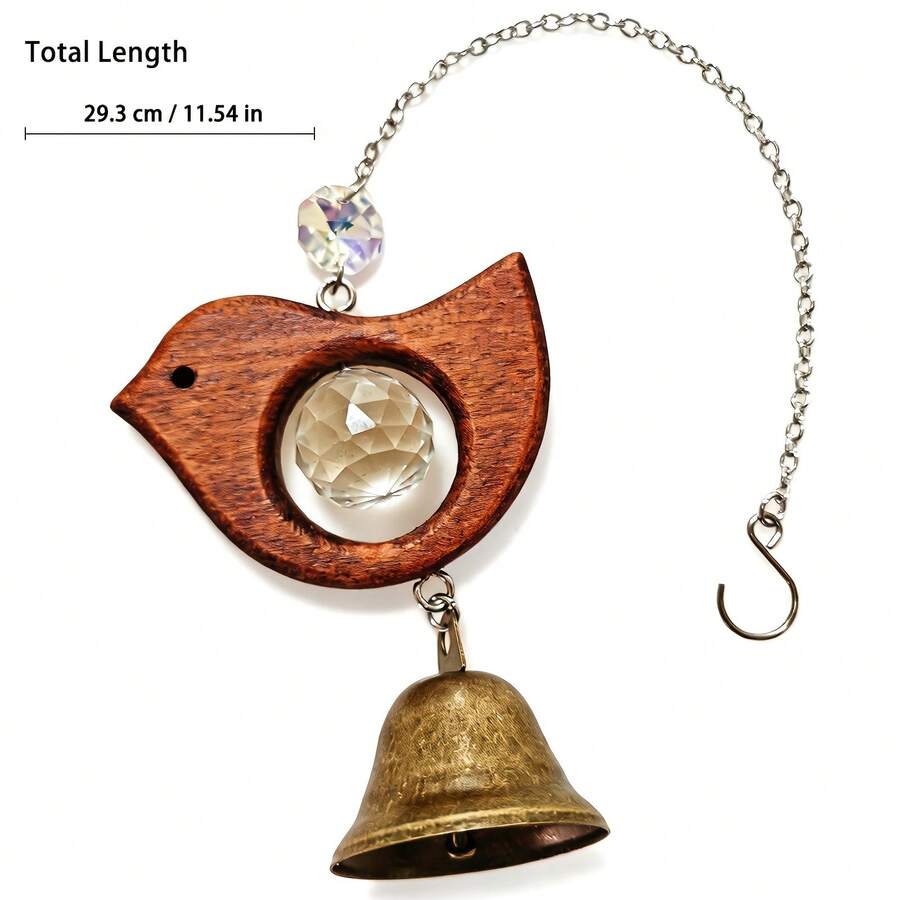 Gift box view of wooden bird hanging light catcher with silver shred.