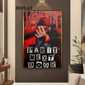 Gold framed PartyNextDoor collage spotlighted on a charcoal living room wall