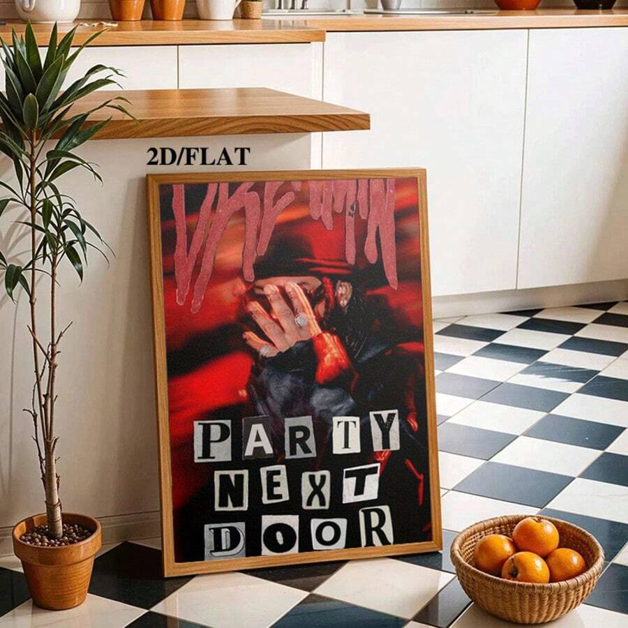 Light wood framed PartyNextDoor artwork leaning in a modern checkerboard kitchen