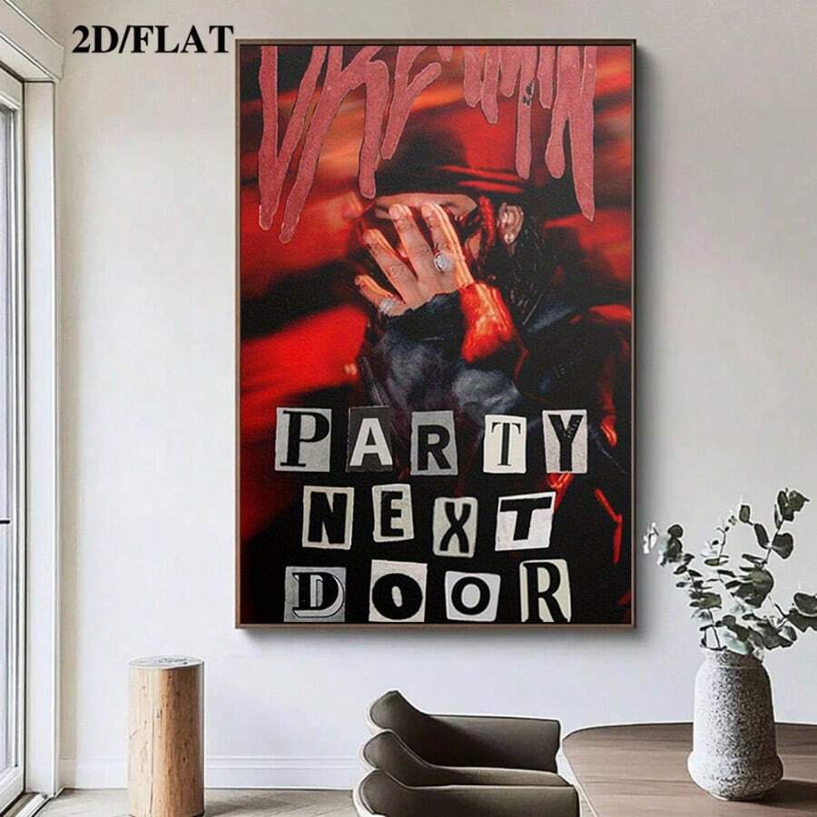 Wall-hung PartyNextDoor poster above a modern dining table beside a tall window