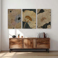 Floral line art triptych above modern console