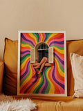 White framed retro rainbow window poster resting on mustard sofa with crossed legs and red wine glass