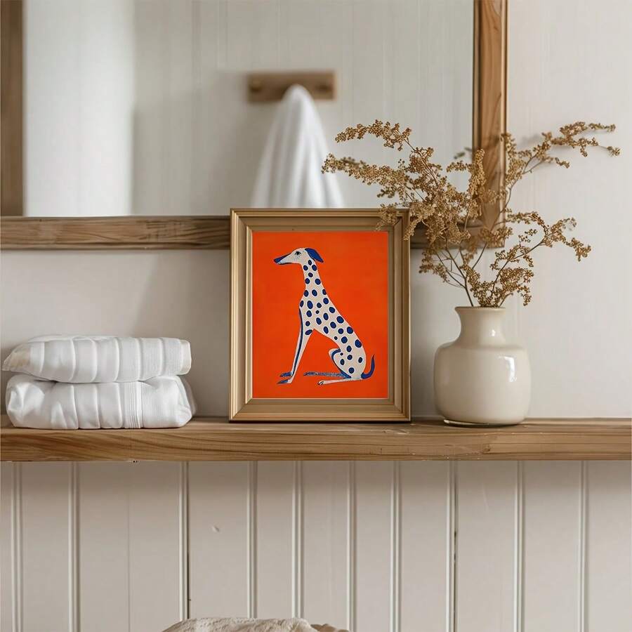 Framed colorful dog wall art leaning on console