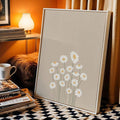 White framed daisy canvas in cozy nook