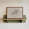 Proverbs 3:5 print on green wall shelf with neutral botanical art and wood frame