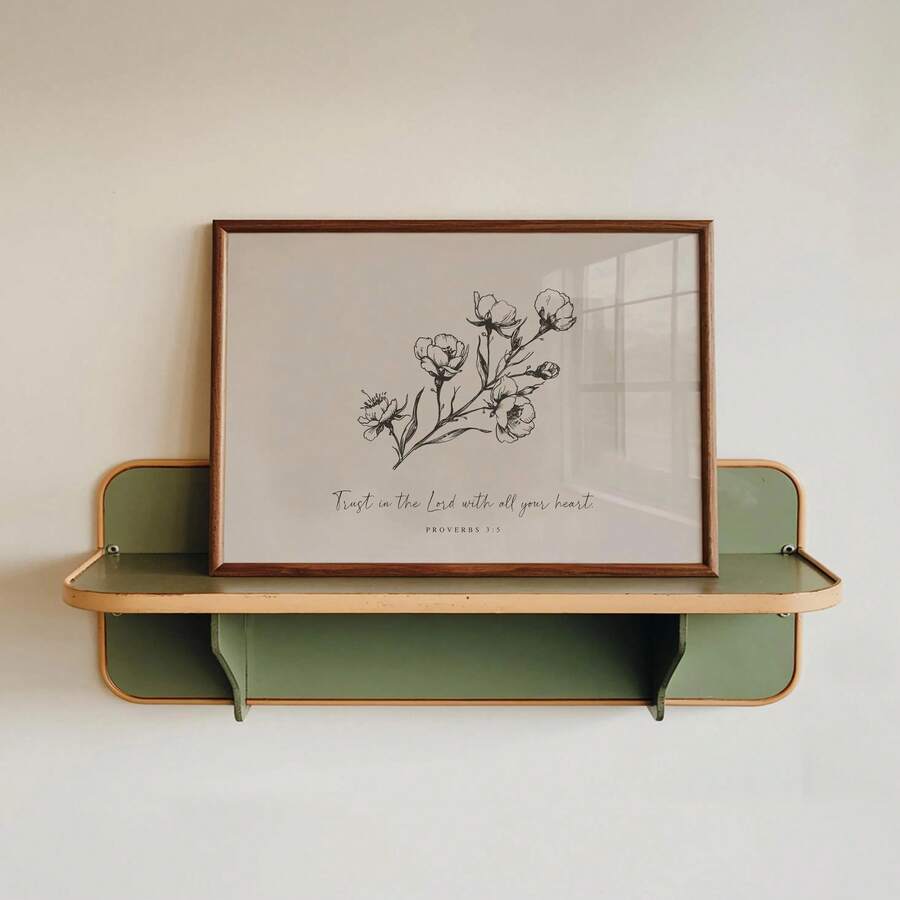Proverbs 3:5 print on green wall shelf with neutral botanical art and wood frame