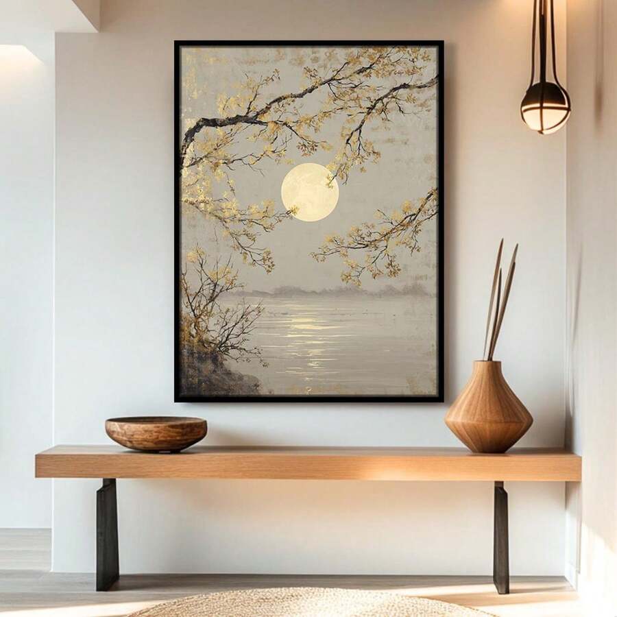 Black framed moonlit lake and branch wall art above console shelf with wood vase and pendant light
