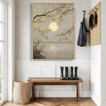 Neutral entryway with framed moon over water print gold blossom branches bench hooks and rain boots