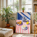 Framed cafe breakfast art leaning by window with plants and books in bright living space