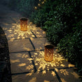 Solar hummingbird lantern feature graphic showing panel, auto on off, and size.