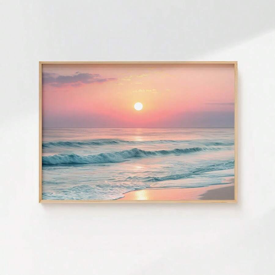 front framed view of Framed coastal wall art print showing ocean waves, beach shoreline, sunrise or sunset sun, pastel sky and soft modern beach house colors.