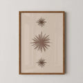 Boho abstract print with three taupe starburst shapes on cream background