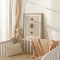 Cream beige starburst poster styled above modern neutral furniture