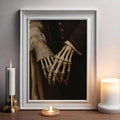 Gothic skeletal hands holding in an ornate white frame beside candles