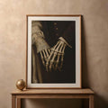 Gothic skeletal hands holding in a wood frame with a white mat