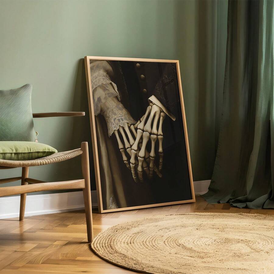 Gothic skeletal hands holding in a wood-framed portrait print in a green room